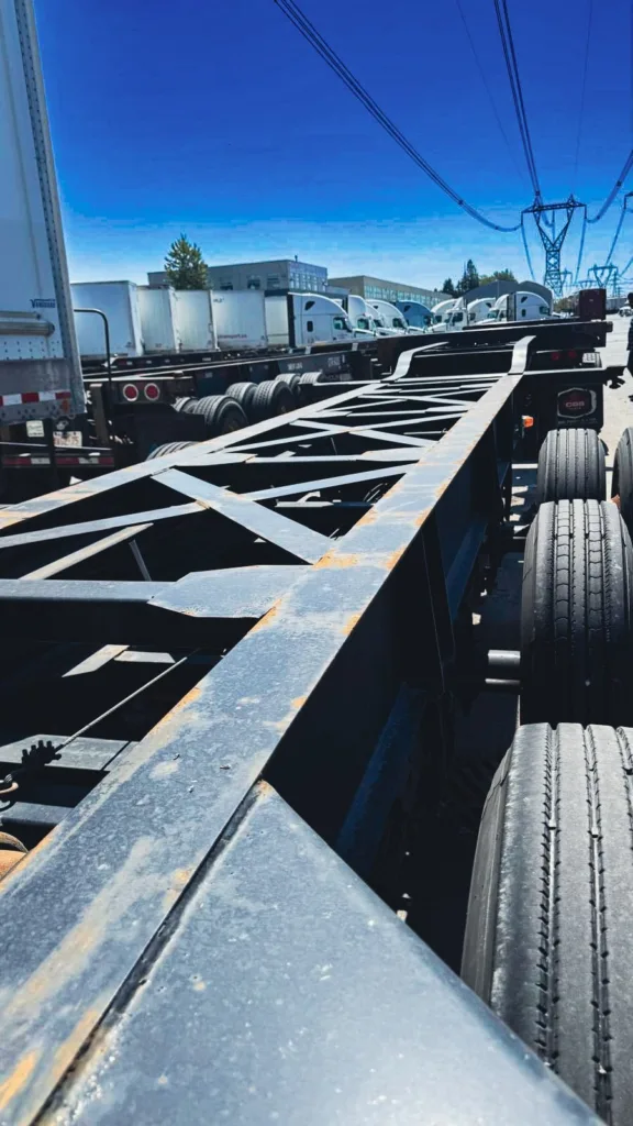 Looking along the deck of a Max-Atlas CCX container chassis on the Mainland yard